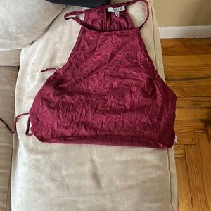 Maroon crop top with cross cross sides. Size medium. Never worn